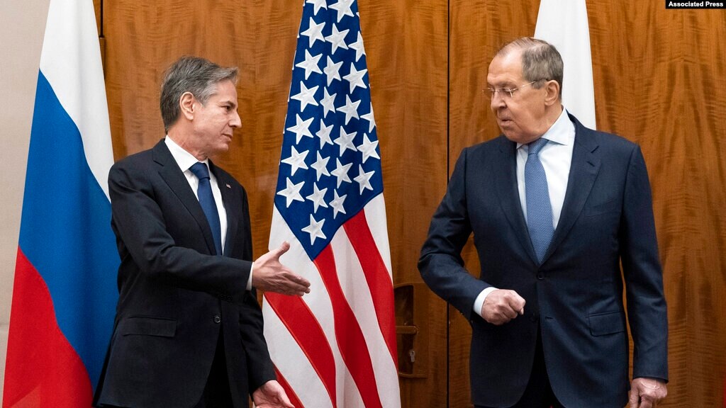U.S. Secretary of State Antony Blinken, left, greets Russian Foreign Minister Sergey Lavrov before their meeting, in Geneva, Switzerland, Jan. 21, 2022.