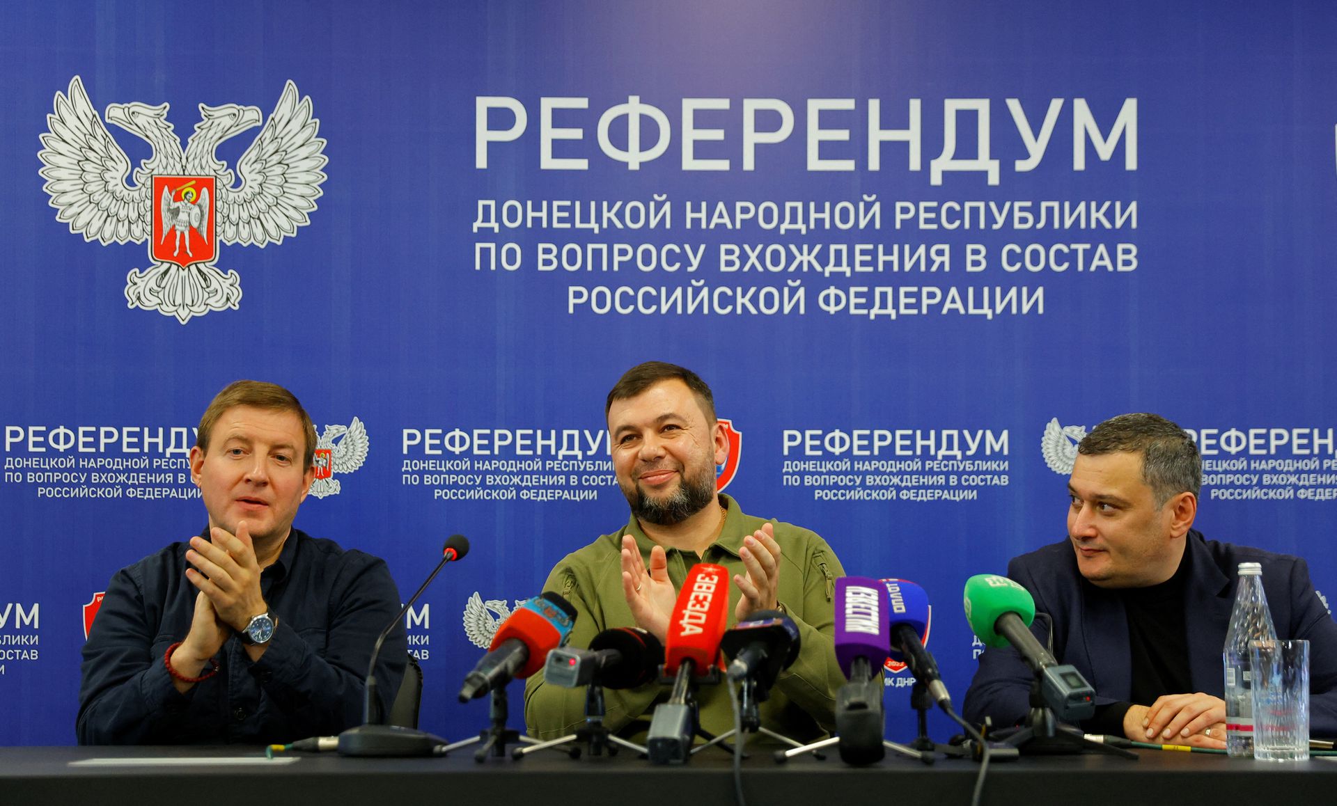 Head of the separatist self-proclaimed Donetsk People's Republic Denis Pushilin, Chairman of the Committee of Russia's State Duma on Information Policy, Information Technology and Communications Aleksandr Khinshtein and Secretary of the United Russia Party's General Council Andrey Turchak attend a news conference on preliminary results of a referendum on the joining of the self-proclaimed Donetsk People's Republic (DPR) to Russia, in Donetsk, Ukraine September 27, 2022. REUTERS/Alexander Ermochenko