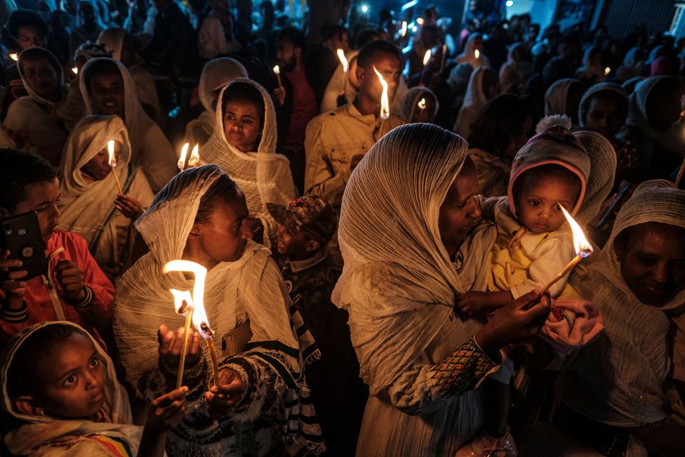 Orthodox devotees hold candles during celebrations on the eve of the Ethiopian Orthodox holiday of Meskel, in Addis Ababa. It is the first big festival of the Ethiopian religious year and marks the finding of the cross that Jesus was crucified on, according to Orthodox Christian tradition.