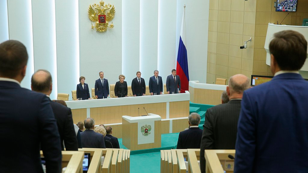The Federation Council of The Federal Assembly of The Russian Federation Press Service, lawmakers of Federation Council of the Federal Assembly of the Russian Federation listen to the national anthem while attending a session in Moscow, Russia, October 4, 2022. /CFP