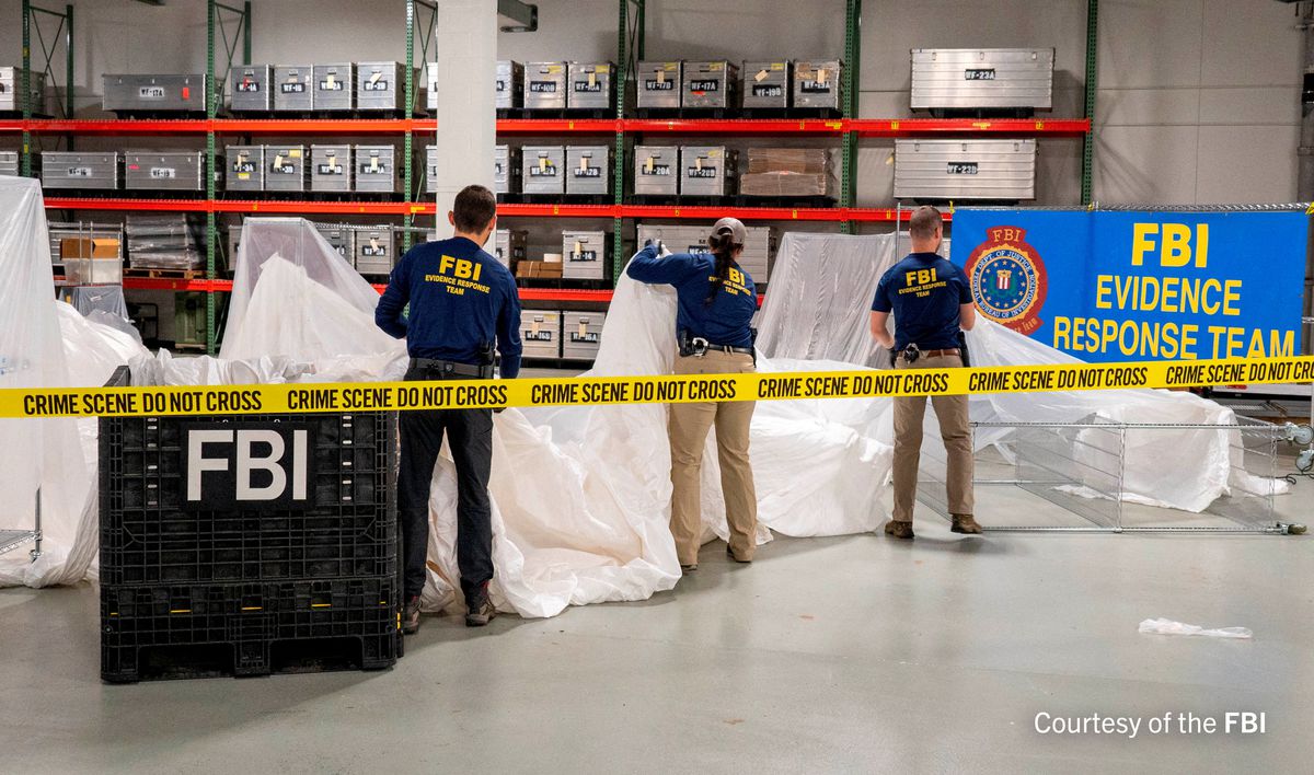An undated U.S. Federal Bureau of Investigation handout photo taken at an undisclosed location shows FBI Special Agents assigned to the bureau’s Evidence Response Team processing material recovered from the high-altitude Chinese balloon that was shot down by a U.S. military jet off the coast of South Carolina, in this image released by the FBI on February 9, 2023. FBI/Handout via Reuters
