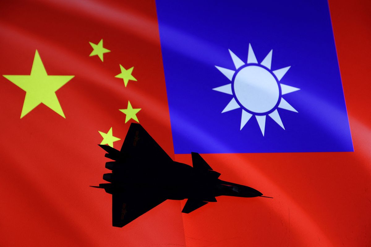 Airplane is seen in front of Chinese and Taiwanese flags in this illustration, August 6, 2022.